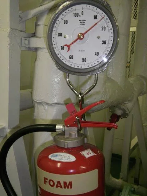 Foam extinguisher on a weighing scale